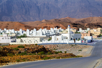 Provincial cozy white city in center of Sultanate of Oman against the backdrop of high mountains