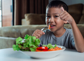 Children do not like to eat vegetables, Little cute boy refuses to eat healthy vegetables,  Nutrition healthy eating habits for kids concept, Children do not like to eat vegetables.
