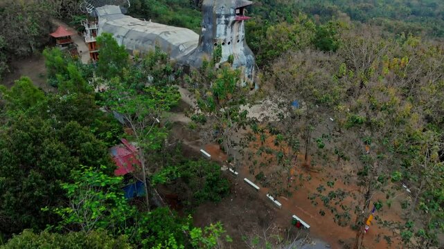 Aerial view of the unique gereja ayam (chicken church) surrounded by lush greenery and forest, yogyakarta, indonesia.