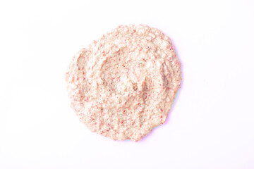 Naklejka premium Creamy milk with pieces of fruit close-up on a white background. Ice cream texture. Delicious sweet dessert close-up as a background.