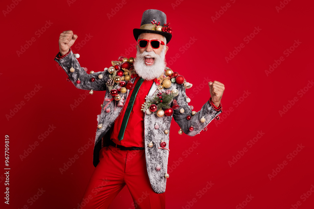 Wall mural Photo of glad positive man wear stylish suit jacket summer glasses top hat isolated on red color background