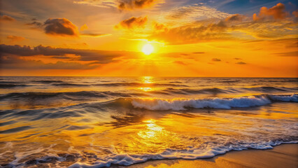 Obraz premium Beautiful sunrise over the sea with shimmering waves in yellow-orange colors , sunrise, sea, waves, sunlight, reflection, colors