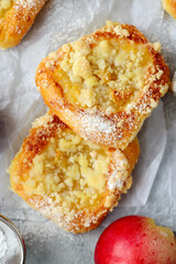 Polish sweet yeast Butter buns with apples and streusel sprinkled with powdered sugar.style hugge .top veiw