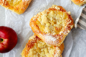 Polish sweet yeast Butter buns with apples and streusel sprinkled with powdered sugar.style hugge .top veiw