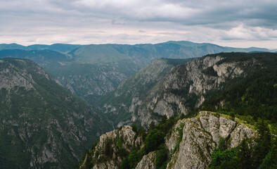 Panoramic Mountain Range and Views - Alpine style Alps in Durmitor, Montenegro - Wide Landscape Shot of epic Mountains and Roads