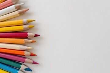 Obraz premium Vibrant Colorful Pencils Fan Array - Brightly Colored School Supplies on White Background