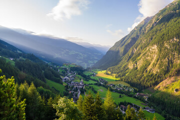 Fototapeta premium Beautiful village of Heiligenblut, Austria. Aerial view of famous tourist attraction in East Tyrol region of Alps. Grossglockner mountain landscape with high snow capped peaks