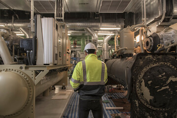 Engineer work in Industrial  chiller  HVAC heating ventilation air conditioning system and pipping...