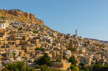 Obraz premium Ancient and stone houses of Old Mardin (Eski Mardin) with Mardin Castle, Located South Eastern of Turkey