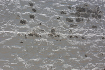 Old white wall with cracks and scratches. Abstract background for design