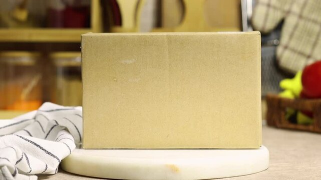 cardboard box on marble surface for product placement in the kitchen