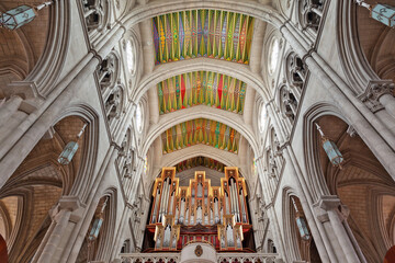 Almudena Cathedral's vibrant ceiling and grand pipe organ, a masterpiece of Gothic architecture in...