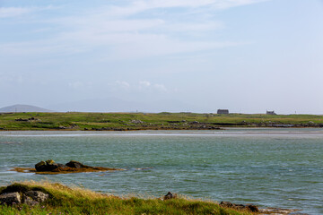 Landscape view of North Uist, Image shows a beautiful scenic photo of the remote Scottish island coastline during the summer 