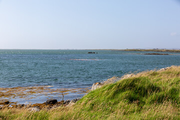 Landscape view of North Uist, Image shows a beautiful scenic photo of the remote Scottish island coastline during the summer 