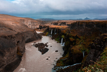 Majestic Canyon River with Waterfalls and Cliffs
