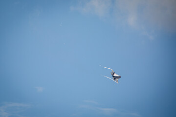 F35 Lightning flying over RAF Lakenheath during sunset creating wingtip vortex's, from a public road