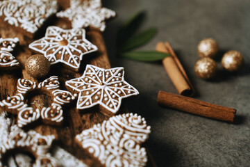 hand-decorated christmas cookies on a wooden background