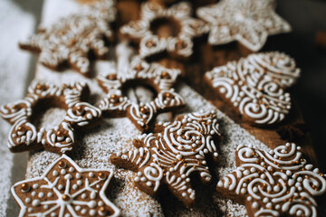 hand-decorated christmas cookies on a wooden background