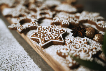 hand-decorated christmas cookies on a wooden background