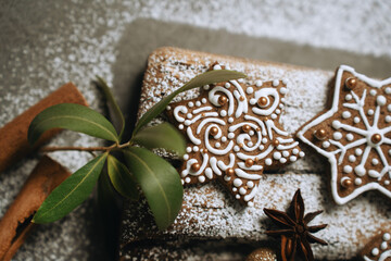 hand-decorated christmas cookies on a wooden background