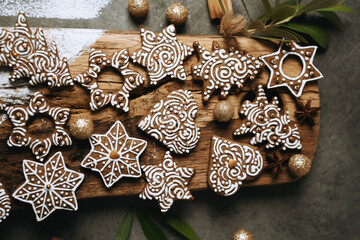 hand-decorated christmas cookies on a wooden background