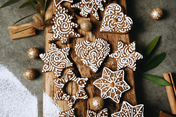 hand-decorated christmas cookies on a wooden background