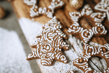 hand-decorated christmas cookies on a wooden background