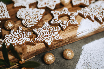 hand-decorated christmas cookies on a wooden background