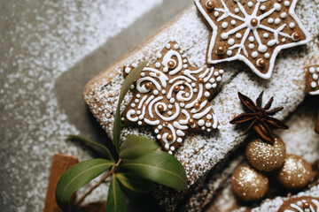 hand-decorated christmas cookies on a wooden background