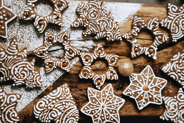 hand-decorated christmas cookies on a wooden background