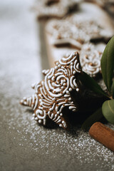 hand-decorated christmas cookies on a wooden background