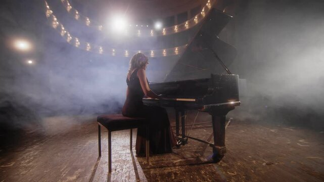 A female pianist plays a beautiful grand piano on stage during a concert - Powered by Adobe