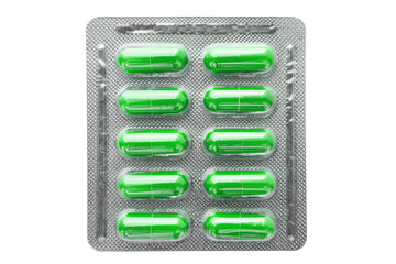 Green medicine capsules and remedy pills in blister pack, pharmaceutical cure, antibiotics or...