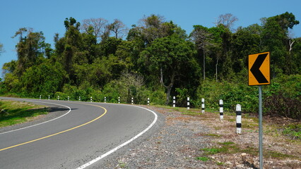 The highway turns in a forest area