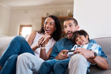 Games, TV and parents with child on sofa in home for bonding, relax and playing online in living...