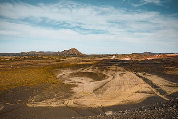 Desolate Volcanic Crater Landscape Under Clear Sky with Rugged Terrain