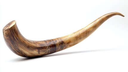 Vintage wooden shofar with curved design, commonly used in Jewish ceremonies and rituals.