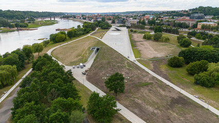 Drone photography of city neighborhood and bridge during summer day