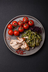Asian food baked chicken breast with green beans, sesame seeds and sauce