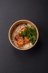 Asian food boiled rice with meat with sweet and sour sauce, spices and herbs