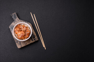 Fototapeta premium Asian food boiled rice with meat with sweet and sour sauce, spices and herbs