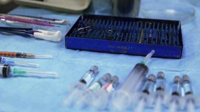 Various medical instruments on a sterile table in the operating room.