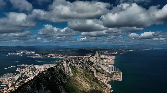 Aerial view of the majestic rock of Gibraltar overlooking the beautiful ocean and port, Gibraltar.