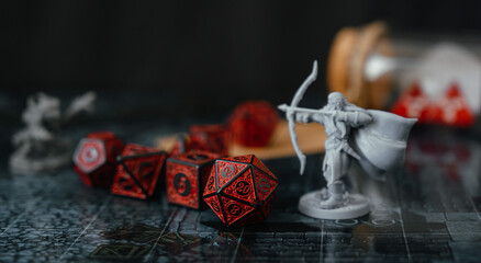 Miniatures and red dice place on playing map. roleplaying board game and hobby board games. for...