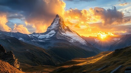 Majestic mountain landscape at sunset with dramatic clouds and warm light.