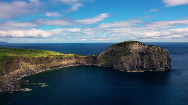 Aerial view of the beautiful rugged cliffs and serene blue ocean, Faial, Azores, Portugal.