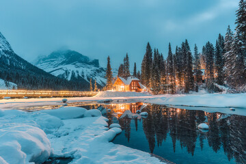 Winter scene of wooden lodge glowing on Emerald Lake at Yoho national park, Canada