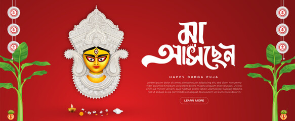 Durga puja festival banner design in red background with goddess durga face illustration with bengali typography maa asche, agomoni calligraphy and durga puja frame
