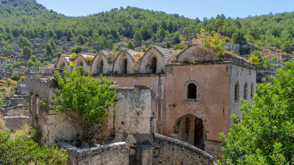 Fototapeta premium Abandoned church in abandoned town or village Kayakoy, neighbourhood of municipality and district of Fethiye, Mugla Province, Turkey