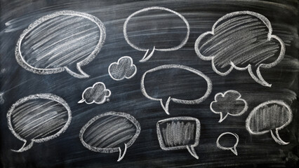 Doodles of speech bubbles in white chalk on black chalkboard background create playful and creative atmosphere, perfect for brainstorming or communication themes